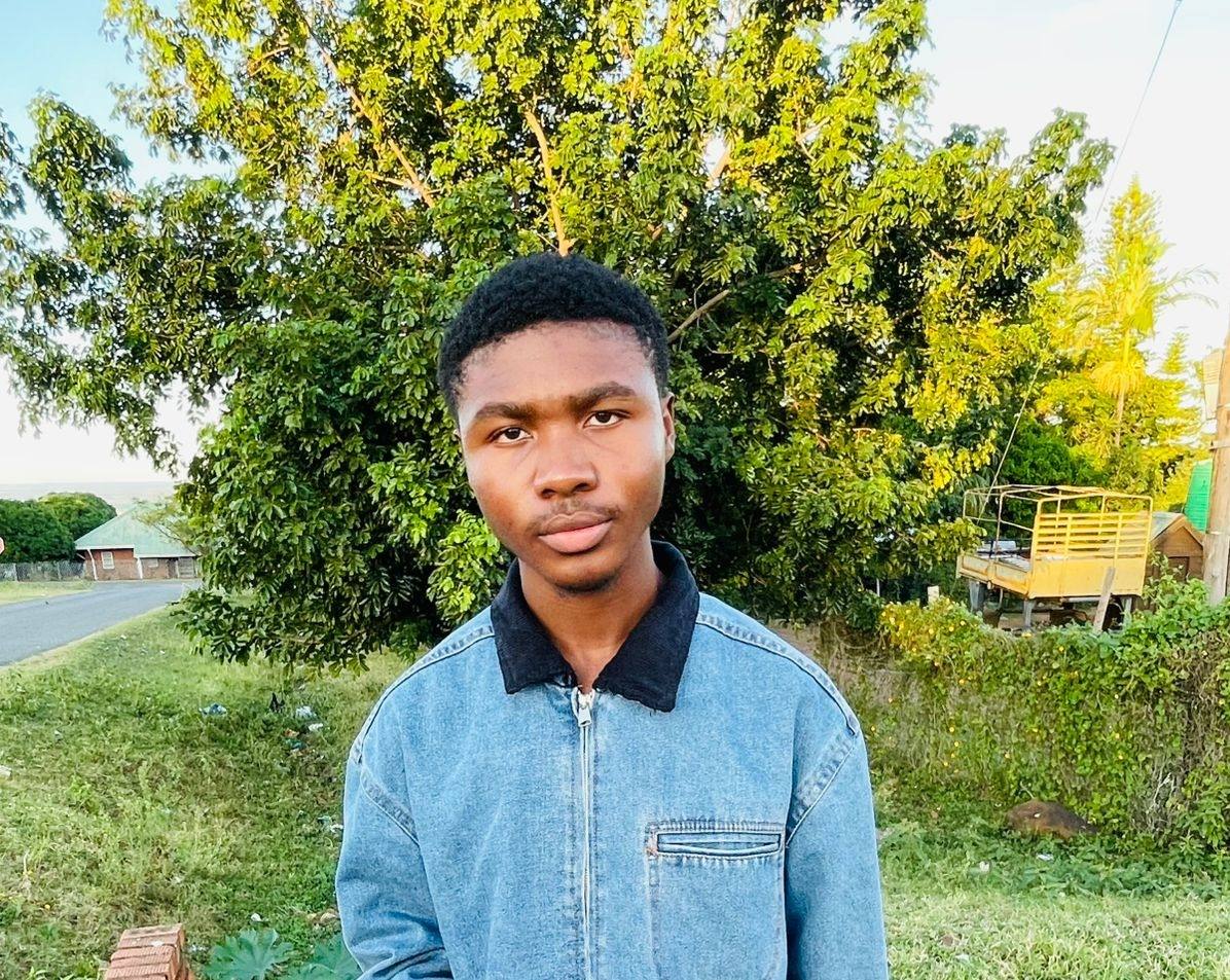 Khethelo Ntsele outdoors wearing a blue jacket